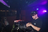 a man djing in a dark room